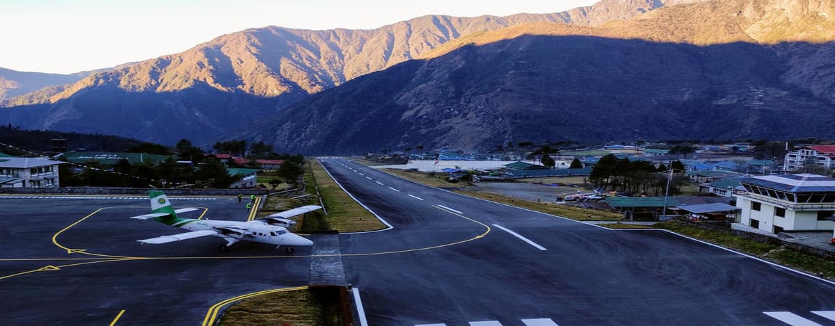 Lukla Airport Flight to EBC Small aircraft landing at Tenzing-Hillary Airport in Lukla before the Everest Base Camp trek