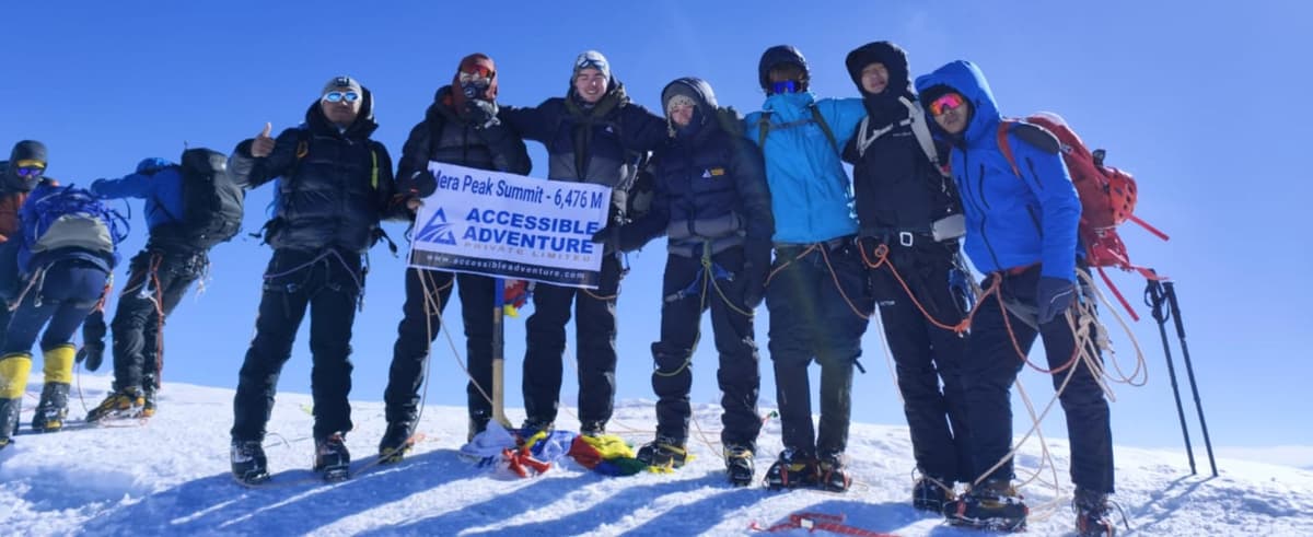 Mera North Summit 6,476 m Climbers celebrating on the Mera North summit at 6,476 m